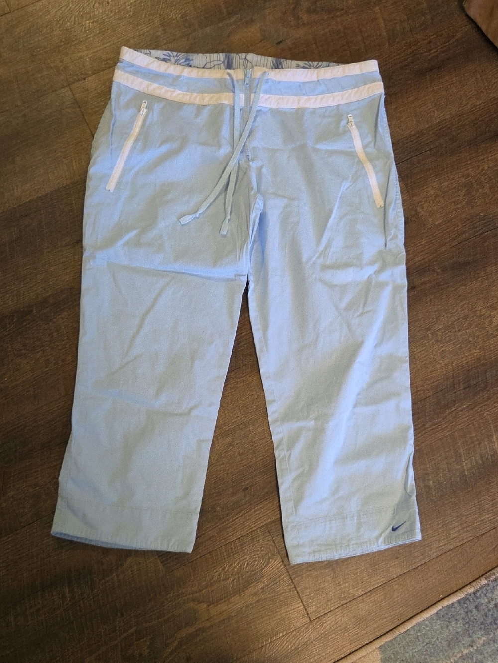 Vintage Nike Light Blue Cropped Track Pants with White Accents